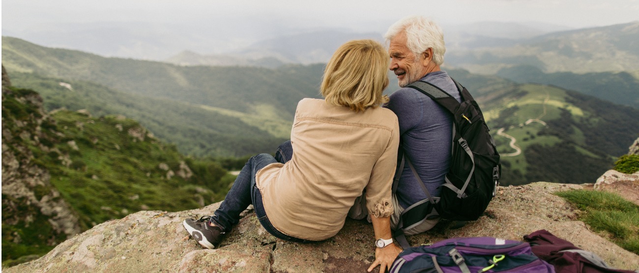 Older couple on top of a mountain